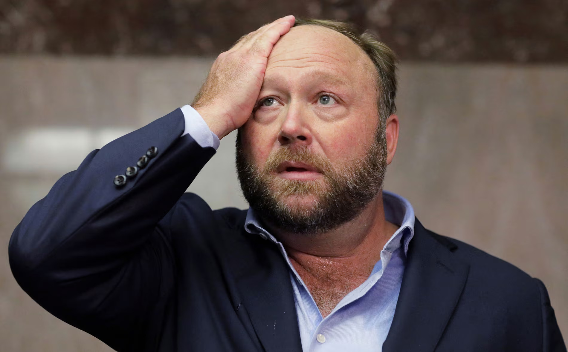 Judge Orders Hearing on The Onion's Bid to Purchase Infowars, Sparking Legal and Cultural Showdown